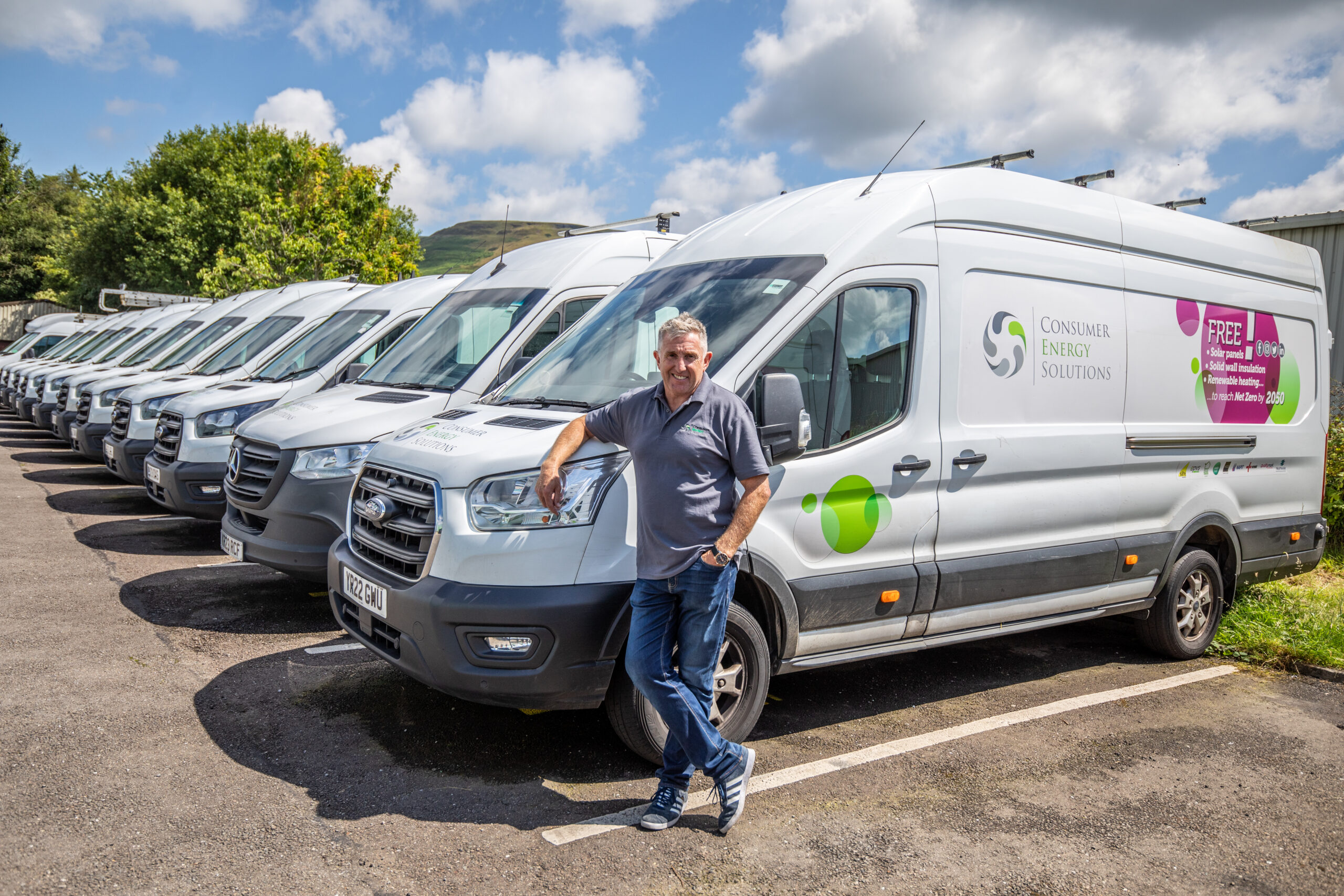 Jonathan Davies stood in front of a van with CES branding.